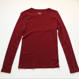Solid burgundy long sleeve shirt.
